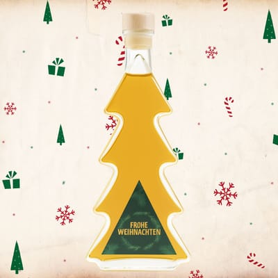 Deheck baked apple liqueur in a Christmas tree bottle